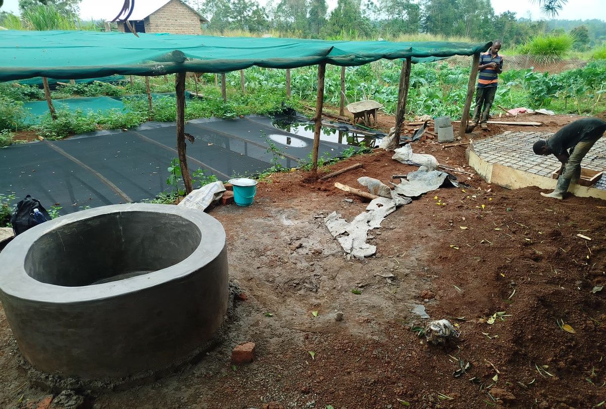 Digester ring with a shade net structure in the background